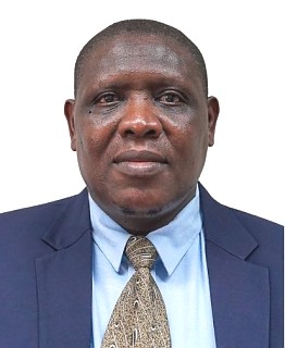 DR. ELIAS PETER BAGUMHE - MINISTER PLENIPOTENTIARY COMMERCIAL (MPCOM)